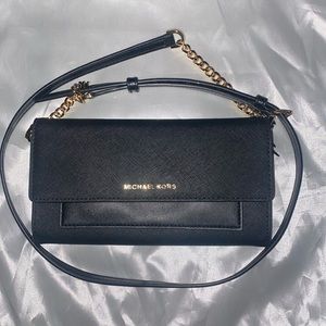 Michael kors jet set black 2 in 1 wallet on gold chain crossbody.